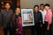 Salihin lors d’une remise de prix, en compagnie de ses parents (à gauche), de son frère et du Dr Teo-Koh Sock Miang, Président de Special Olympics Singapour (tout à droite). <br /><span>Crédit photo : ministère des Communautés, de la Jeunesse et du Sport (MCYS)</span>